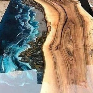 modern resin art wooden furniture

handcrafted epoxy wooden slab table

custom resin ocean table design