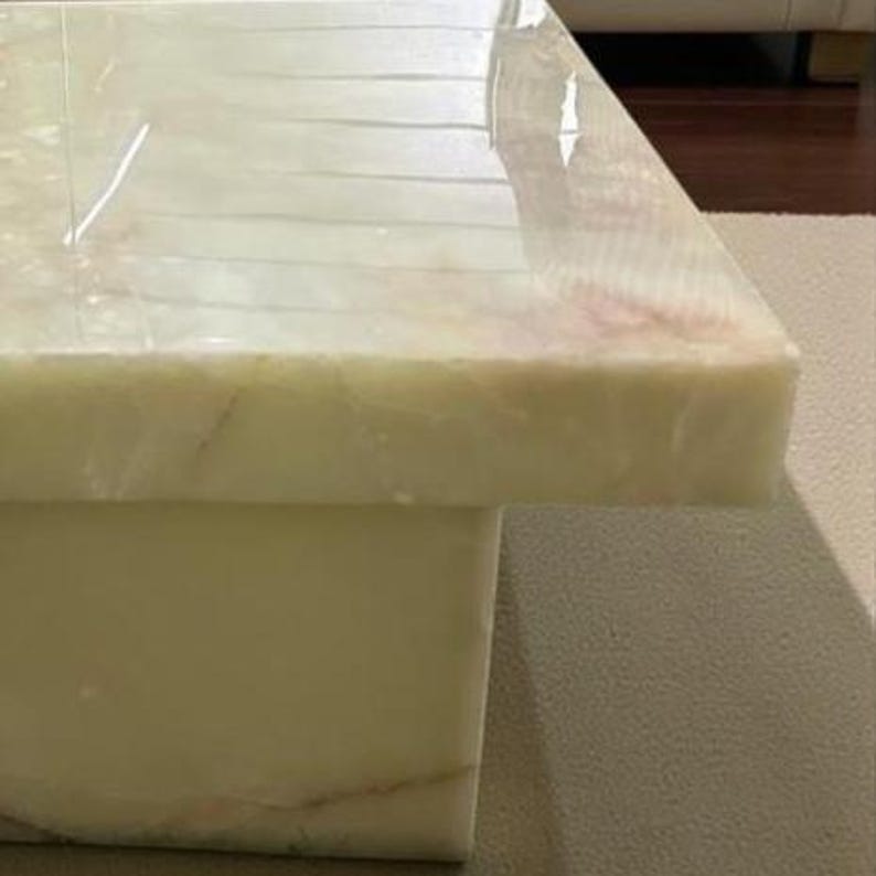 Luxury natural onyx stone table with unique crystal patterns used as a centerpiece in a contemporary living room