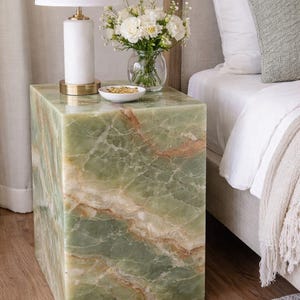 Green onyx bedside nightstand table with natural stone veining