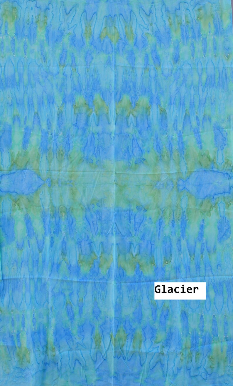 May include: A blue and green tie-dye fabric with the word "Glacier" printed in black.