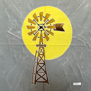 May include: A brown windmill with a yellow sun behind it. The windmill has a ladder and a small flag on the side. The background is a light gray.