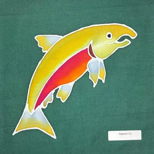 May include: A fabric panel featuring a stylized salmon illustration with a yellow head and back, a vibrant red and orange midsection, and light blue fins against a solid dark green background. A white label in the corner displays the text Salmon D1.