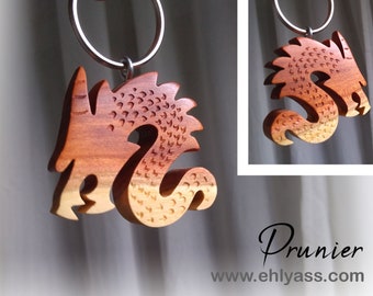 Hand-carved wooden dragon keychain by Ehlyass