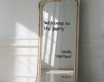 May include: A full-length mirror with an ornate frame, featuring a welcome sign that reads "welcome to the party" and a personalized message for Sarah & Michael with the date 06.06.25.