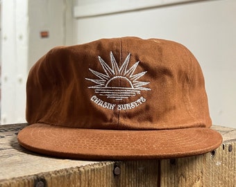 Chasin' Sunsets Unconstructed 6 panel hat flat brim and adjustable strap backing