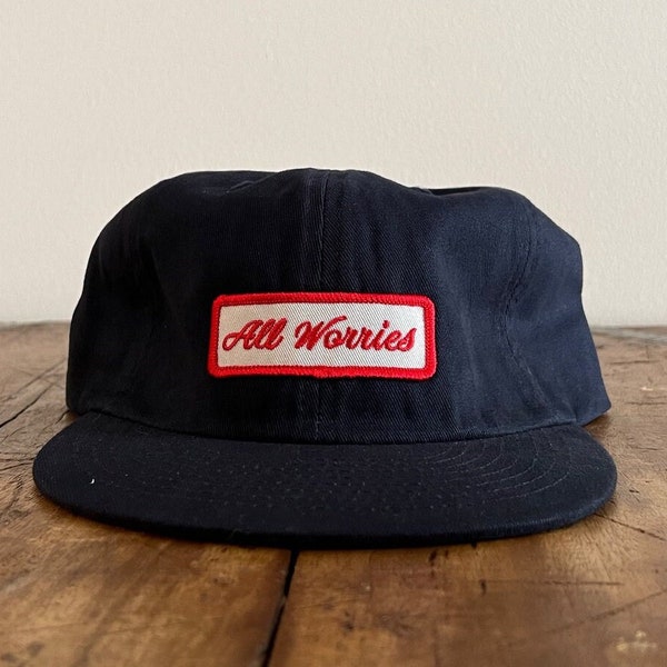 All Worries Patch Unconstructed 6 panel hat flat brim and adjustable strap backing (multiple colors)