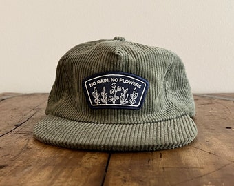 No Rain, No Flowers Embroidered Patch Unconstructed 6 panel hat flat brim and adjustable strap backing (multiple colors)