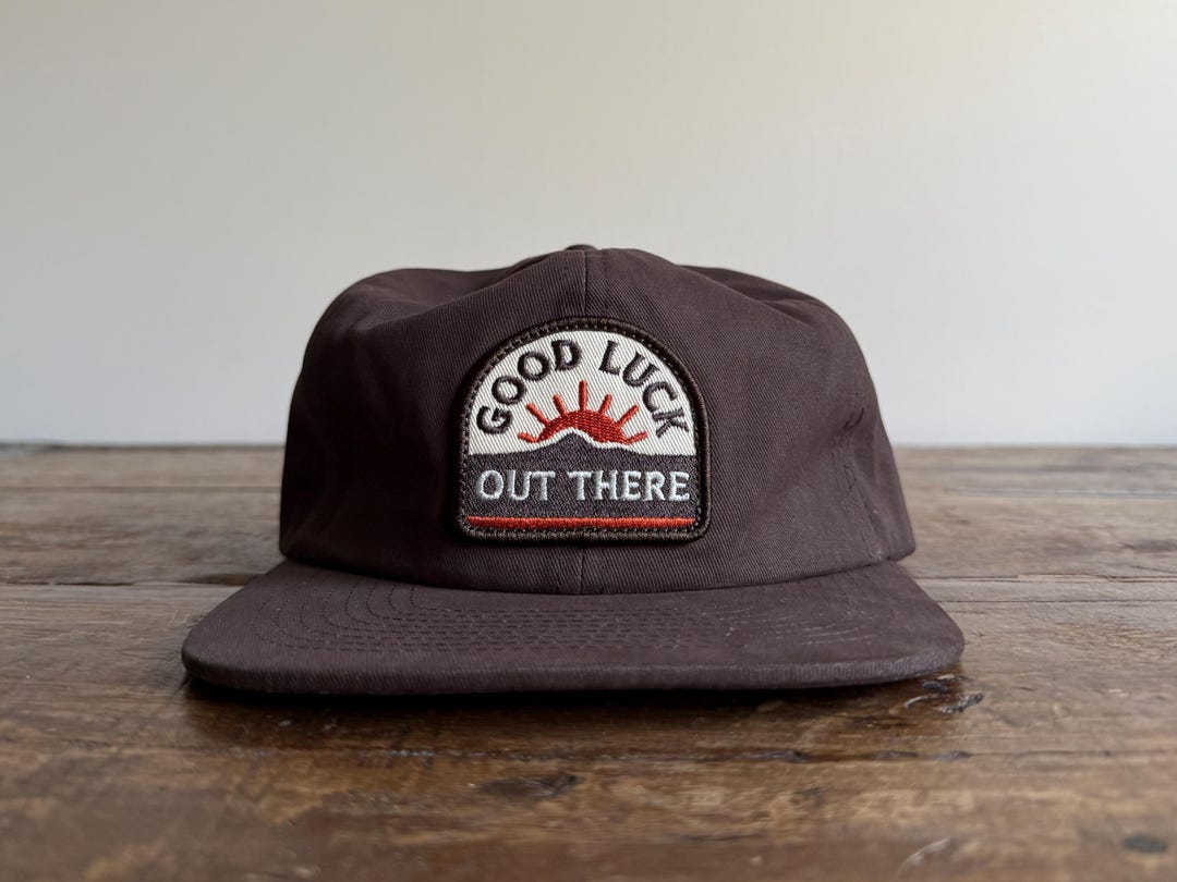 Good Luck Out There Patch Unconstructed 6 panel hat flat brim and adjustable strap backing