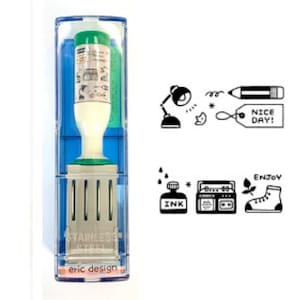May include: A self-inking stamp in a clear plastic case with a blue interior. The stamp has a white handle and a green ink cartridge. The stamp's design includes small illustrations and the words "NICE DAY!" and "ENJOY". The base of the stamp reads "STAINLESS STEEL" and "eric design".