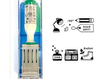 May include: A self-inking stamp in a clear plastic case with a blue interior. The stamp has a white handle and a green ink cartridge. The stamp's design includes small illustrations and the words "NICE DAY!" and "ENJOY". The base of the stamp reads "STAINLESS STEEL" and "eric design".