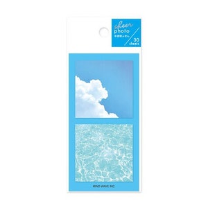 May include: A pack of 30 sheer photo sticky notes featuring a blue sky with a white cloud and a blue water ripple pattern. The pack is labeled "sheer photo" and "30 sheets".