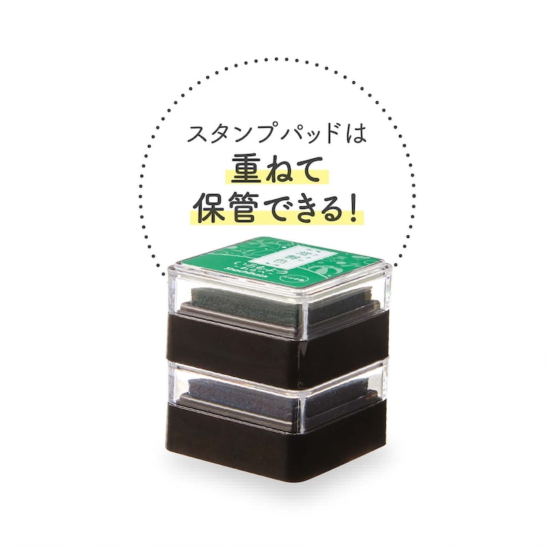 Puede incluir: Un sello de pl&aacute;stico negro y transparente con una almohadilla de tinta verde. El sello tiene texto japon&eacute;s. El texto dice "&iexcl;La almohadilla de tinta es importante para el almacenamiento!"