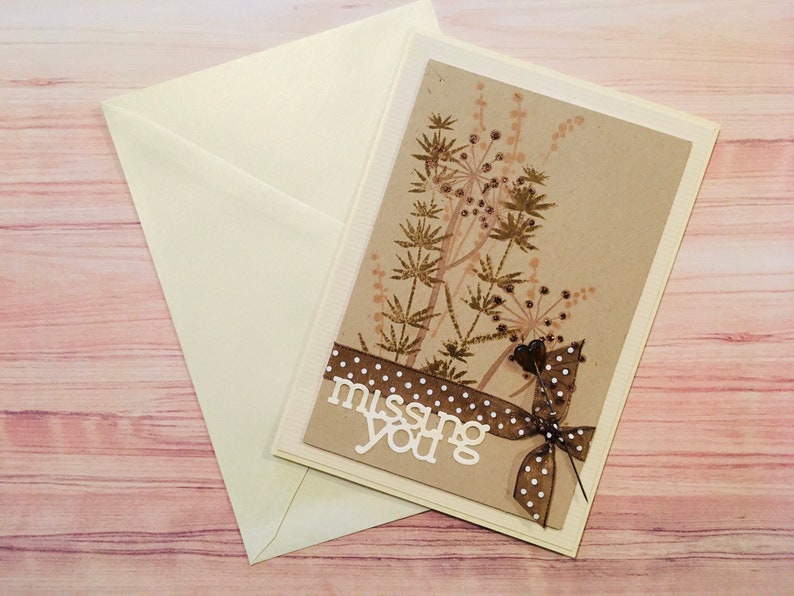 Foliage decoration on kraft-colored background 3D map Missing you