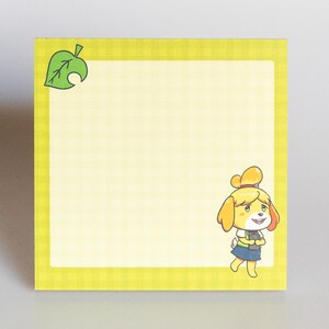 May include: Yellow and green notepad with a checkered pattern and a cartoon image of a dog wearing a blue and green outfit. The dog is holding a green leaf. The notepad has a green leaf in the top left corner.