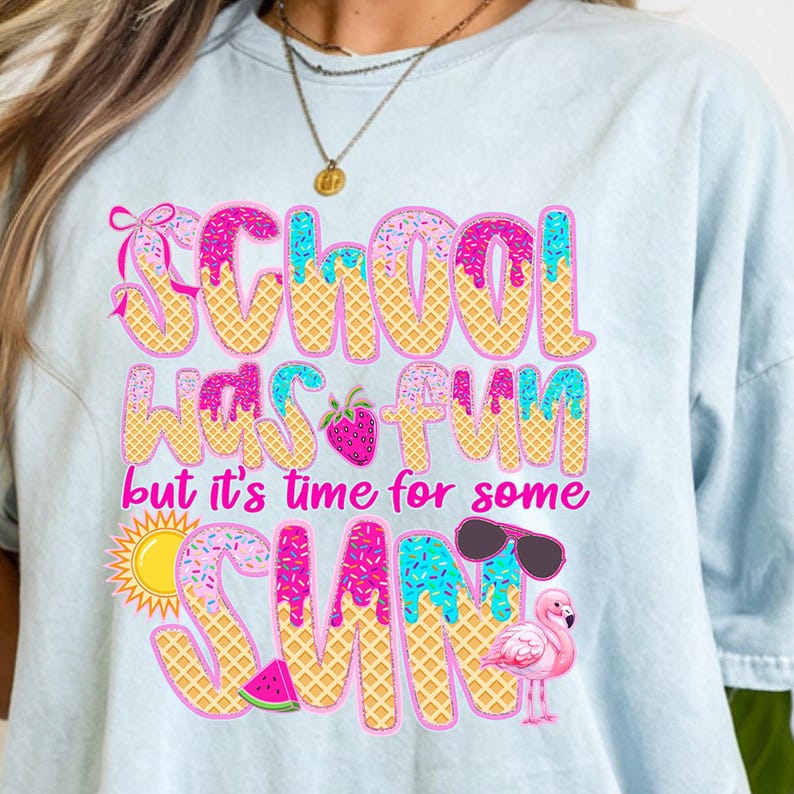 May include: Light blue t-shirt with a pink, yellow, and blue graphic that says "School was fun but it's time for some sun". The graphic is decorated with sprinkles, a strawberry, sunglasses, a watermelon, and a flamingo.