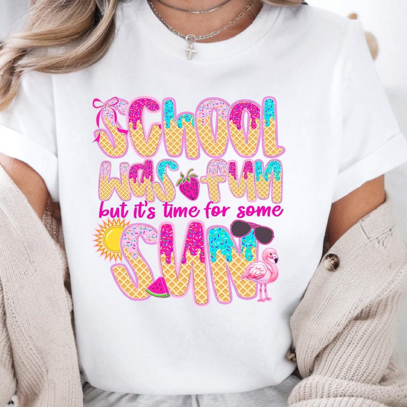 May include: White t-shirt with a pink, blue, and yellow graphic that says "School was fun but it's time for some sun". The graphic features a strawberry, sunglasses, a watermelon, a flamingo, and a sun.