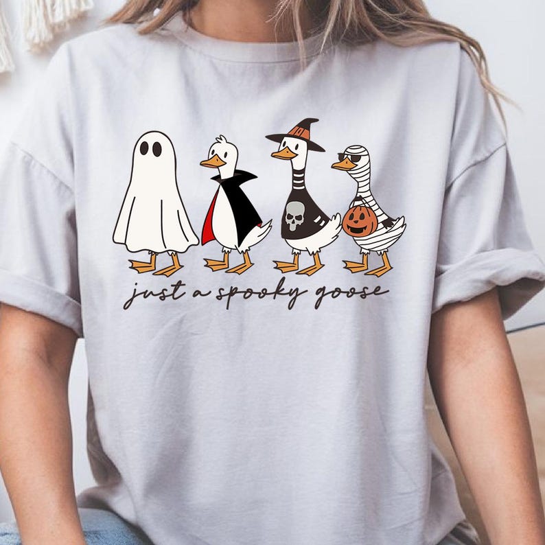 a woman wearing a t - shirt that says just a spooky place