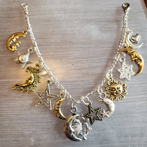 Moon Stars and Sun Bracelet Handmade Victorian Vintage Recycle Fashion and Costume jewelry with 12 different charms.  Free shipping eligible