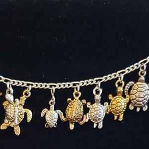 Turtles Bracelet Handmade Vintage Recycled Victorian Fashion and Costume jewelry with 12 unique different charms. Spend 35 get FREE SHIPPING
