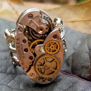 Steampunk Ring Handmade Vintage Victorian Recycled Upcycled from ladies watch parts fashion/costume jewelry  mounted on a new filigree ring.