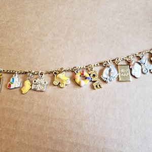 Baby charm bracelet for mom.  Handmade vintage Victorian recycled fashion & costume jewelry with 12 unique charms. Free shipping eligible.