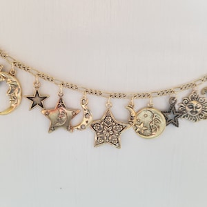 Moon, Stars and Sun Bracelet Handmade in gold tones Vintage Victorian recycled with 12 unique and different  charms.  Free shipping eligible