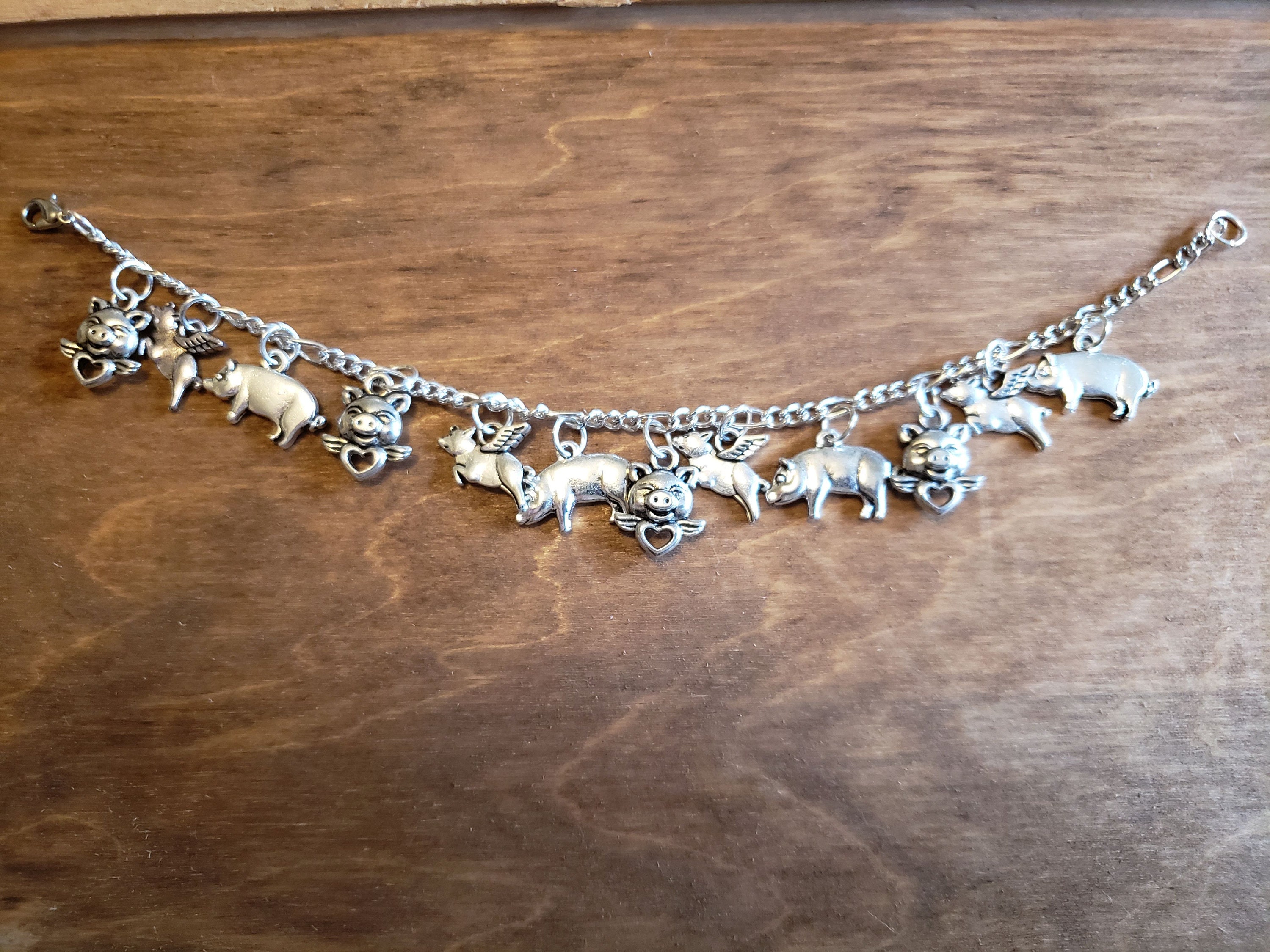 Pig charm bracelet Handmade vintage recycled Victorian fashion and costume jewelry in silver tones with 12 charms. Free shipping eligible