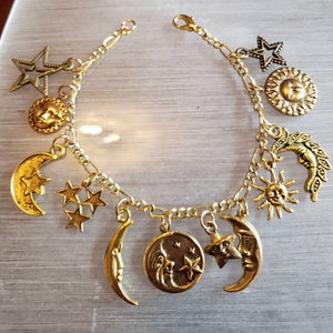 Moon, Stars & Sun Bracelet Handmade Victorian Vintage Recycled Fashion/Costume jewelry with 12 different charms.  Free shipping eligible.