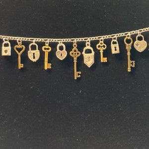 Lock and Key Gold Bracelet Handmade Vintage Recycled Victorian Costume & Fashion Jewelry with 12 unique charms.  Free shipping eligible