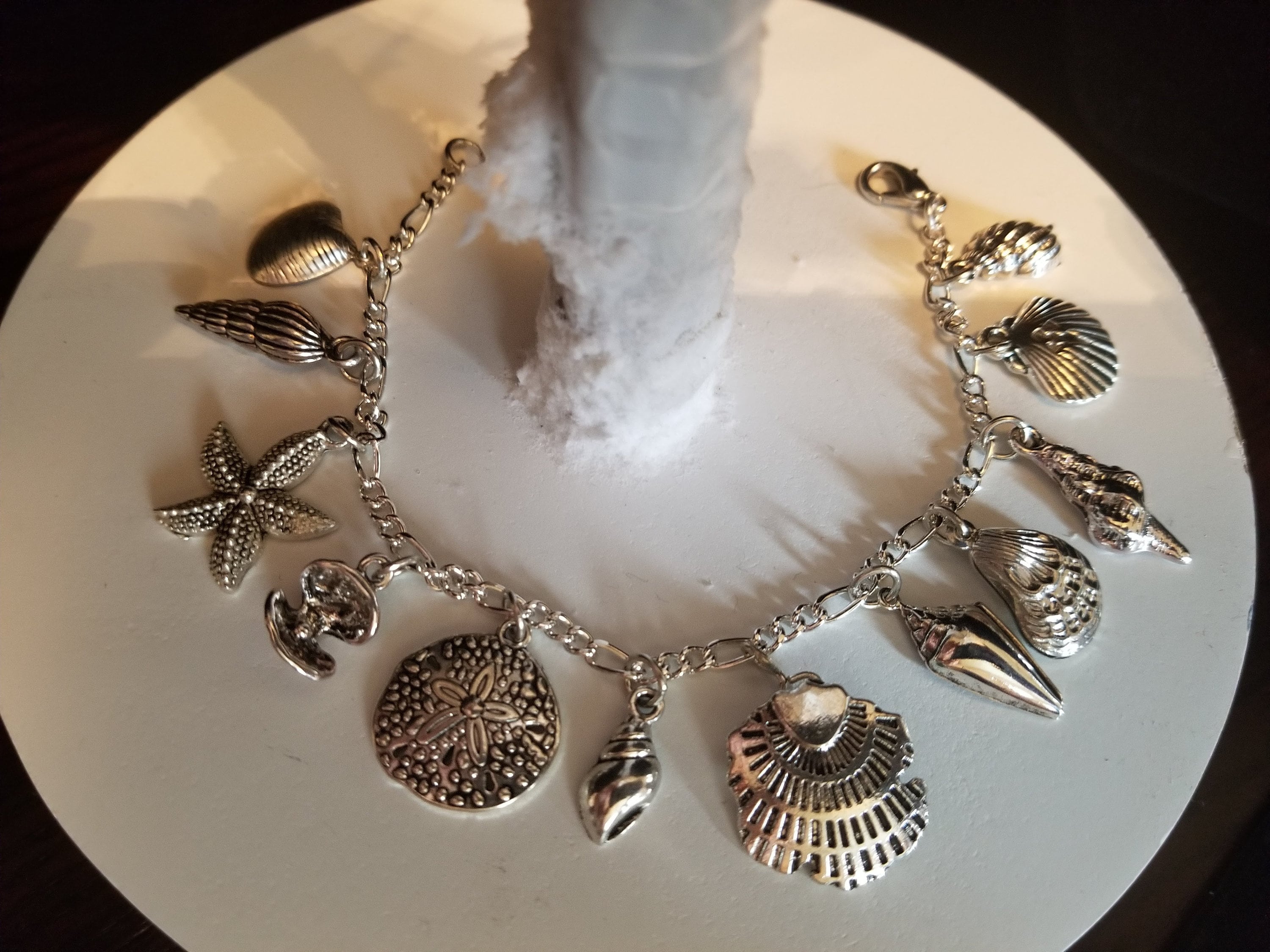 Seashells bracelet Handmade vintage Victorian recycled fashion and costume jewelry with 12 different charms. Free shipping eligible.
