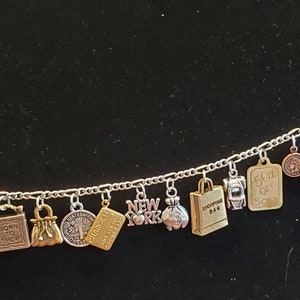 Shopping Bracelet. Handmade Vintage Recycled Vintage Unique fashion/costume jewelry w/ silver & gold charms.  Spend 35.00 for FREE SHIPPING.