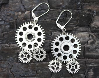 Earrings Steampunk watch part and clock part wheels and cogs.  Surgical steel lever back ear wires.  Can be converted to clip.