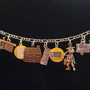 Real Estate Bracelet Vintage Victorian recycled Steampunk fashion and costume jewelry in silver and  gold tones  with 12 different charms .