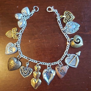Hearts charm bracelet Handmade Victorian vintage recycled costume and fashion jewelry with more than 15 unique charms.  Free ship eligible