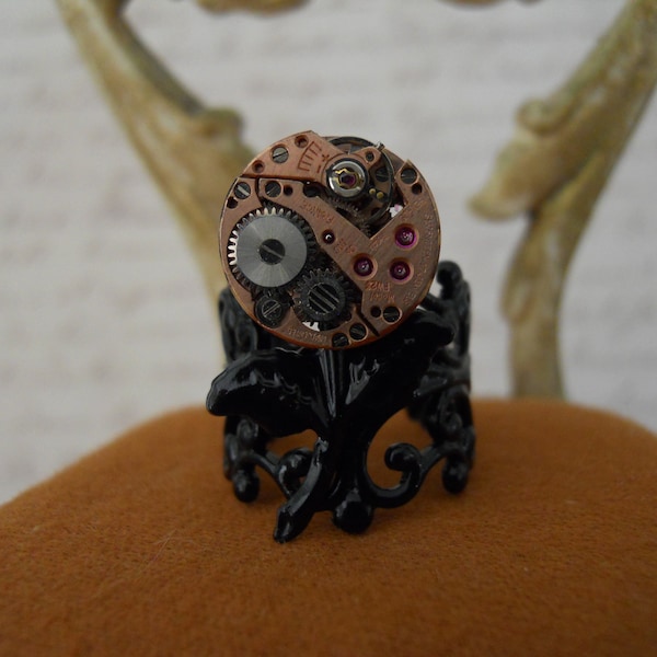Steampunk Ring Tiny Vintage Round Rose Gold Benrus Watch Movement Rubies Set as Flower on Black Filigree Leaves Adjustable Band