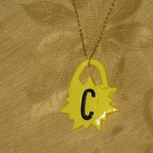 Yellow Sun, with one personalized black capital C initial raised design pendant necklace