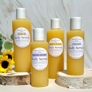 multiple bottles of body serum with a white label to reflect the different size options. The label says 'Preshious Body Natural Handcrafted Skincare’ Body Serum Nourishing Antioxidant Rich Moisturizer for Soft Smooth Skin *etsy@preshiousbodynatural'