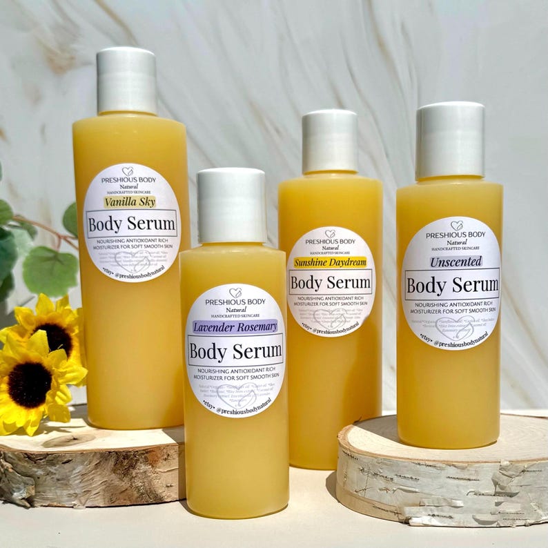 multiple bottles of body serum with a white label to reflect the different size options. The label says 'Preshious Body Natural Handcrafted Skincare’ Body Serum Nourishing Antioxidant Rich Moisturizer for Soft Smooth Skin *etsy@preshiousbodynatural'