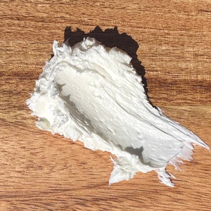 A photo of creamy body butter with its texture shown