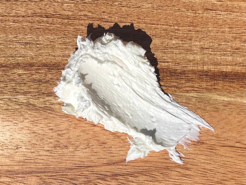 A photo of creamy body butter with its texture shown