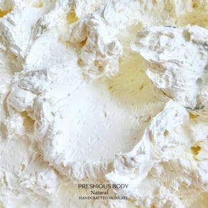 A photo of creamy body butter with its texture shown