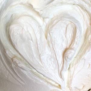 A photo of creamy body butter with its texture shown
