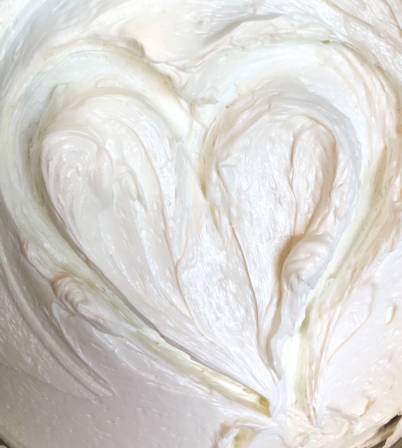 A photo of creamy body butter with its texture shown