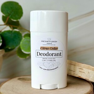 Puede incluir: Barra de desodorante blanca con una etiqueta que dice "PRESHIOUS BODY Natural HANDCRAFTED SKINCARE Citrus Cedar Deodorant BAKING SODA FREE CLAY | CHARCOAL *etsy @preshiousbodvnatural"