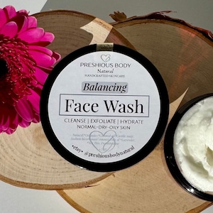 Puede incluir: Un tarro negro con una etiqueta blanca que dice "PRESHIOUS BODY Natural HANDCRAFTED SKINCARE Balancing Face Wash CLEANSE | EXFOLIATE | HYDRATE NORMAL-DRY-OILY SKIN Nataral *Onnle* Coconut oil *Cartile* soap Sodium Normate essentiall of Lavender, *etsy* @preshiousbodynatural"