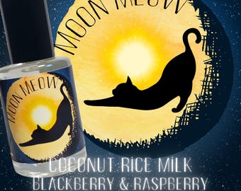 May include: A perfume bottle with a black cap and a label featuring a black cat silhouette stretching in front of a yellow moon. The words "MOON MEOW" are arched above the cat. Below the image are the words "COCONUT RICE MILK, BLACKBERRY & RASPBERRY, SPICED SANDALWOOD."