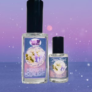 May include: Two glass bottles of perfume with a purple and white label. The label features a butterfly and the text "Midnight Moonlight".