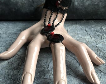 Red and black bracelet ring 36