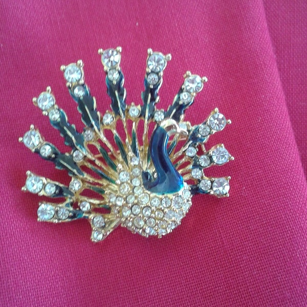 Vintage Peacock Fanned out pin. Beautiful stones, and enamel Gold plated