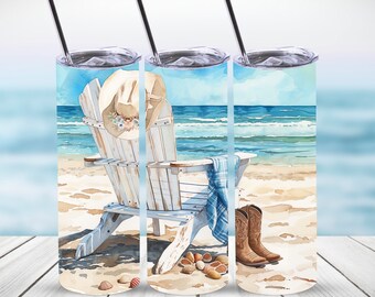 May include: A white Adirondack chair with a straw hat on the back, a blue and white plaid blanket draped over the arm, and brown cowboy boots on the sand. The chair is on a beach with blue water and white waves in the background.